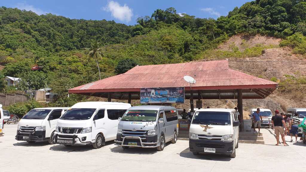 Minivans waiting for passengers at El Nido Van Station