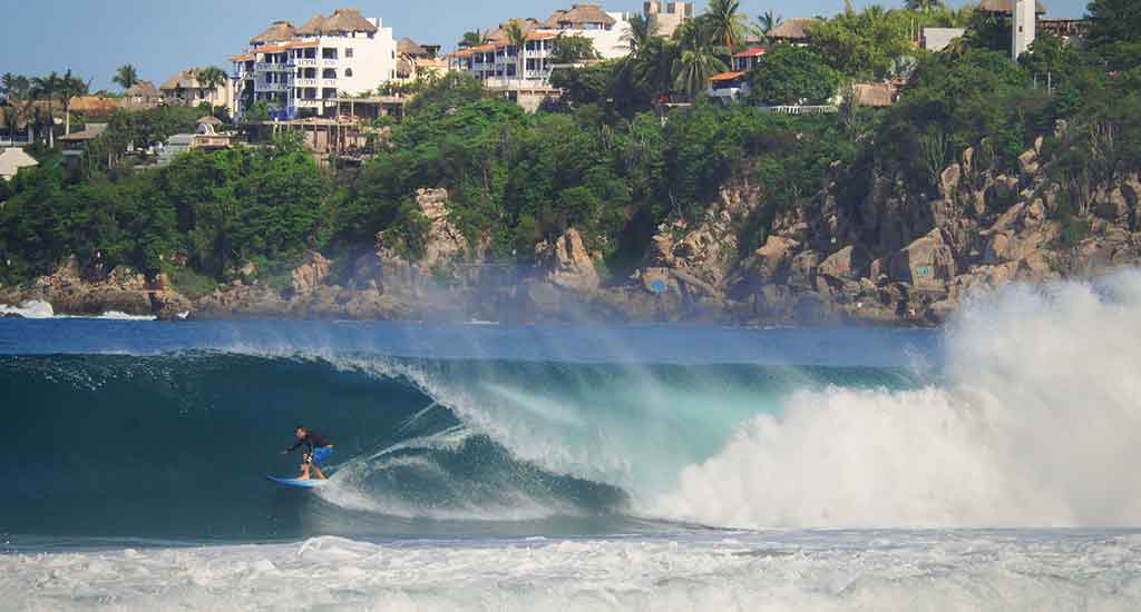 Surfer in Playa Zicatela Puerto Escondido Mexico