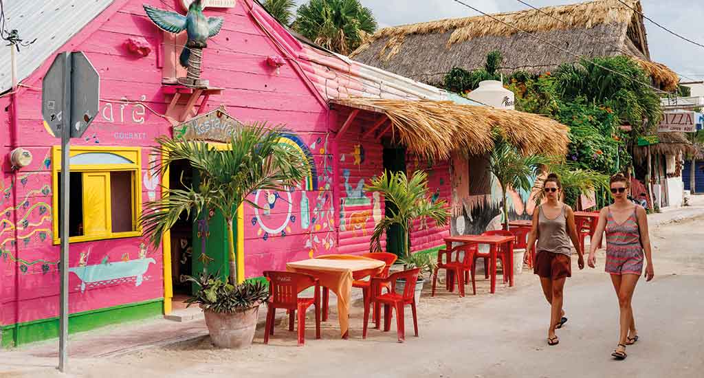 Tourists walking on streets of Holbox