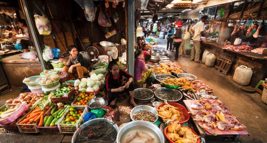 Cambodian women sell farm products in central market in Kampot