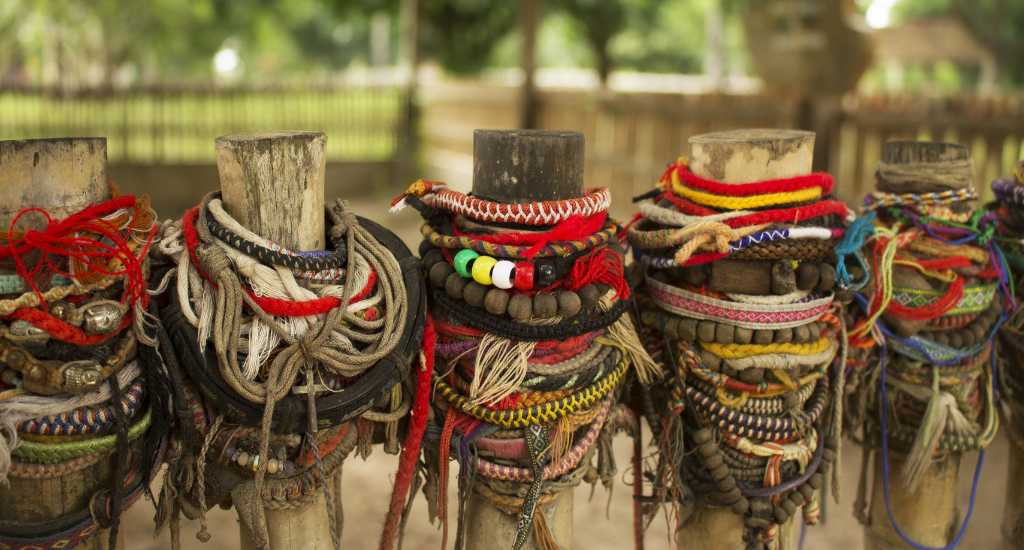 Colourful bracelets in the memorial for the dead at Choeung Ek in Cambodia