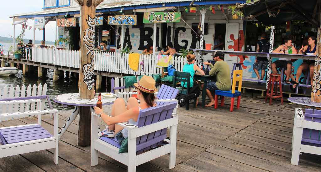 Tourists drinking at a waterfront bar in Bocas del Toro