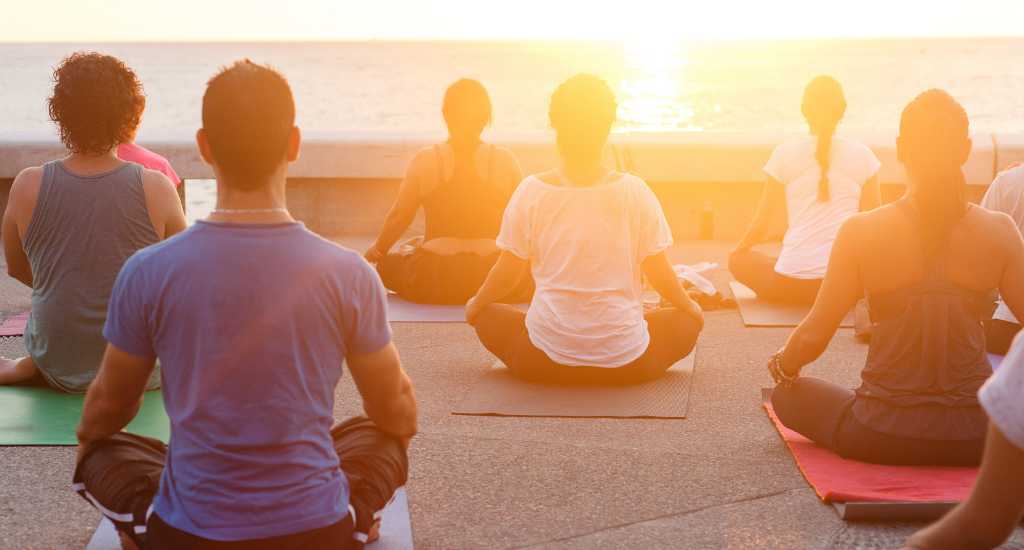 Yoga by the beach at sunset