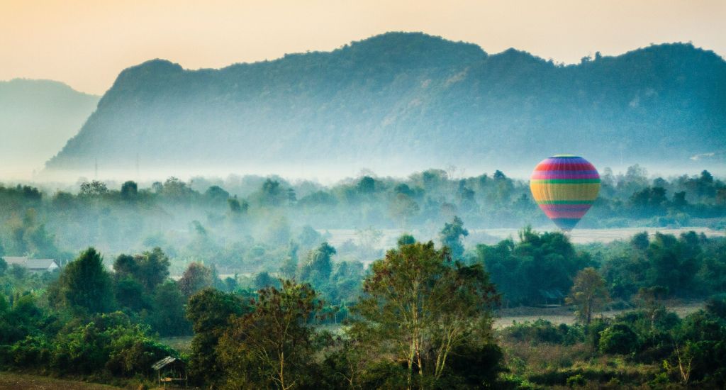 Hot air balloon at sunrise over Vang Vieng