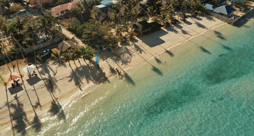 Cream color sand and clear waters in Santa Fe Beach, Bantayan Island, Cebu