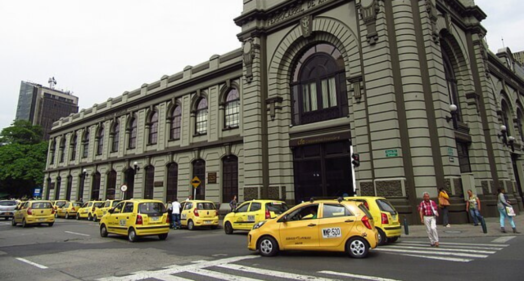 Taxis running along a road in Medellin, Colombia