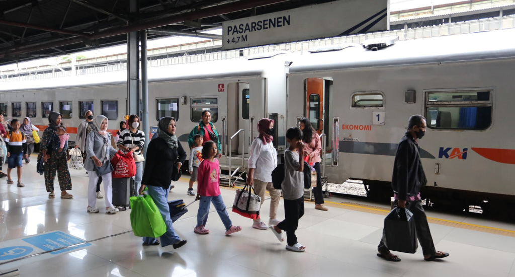 People walking in a train station in Indonesia